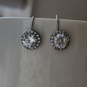Beautiful 925 sterling silver earrings with lab made white sapphire.